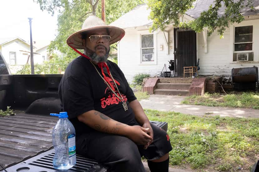 Robert Patterson sits in a shady spot outside his home Wednesday as he dealt with a second...