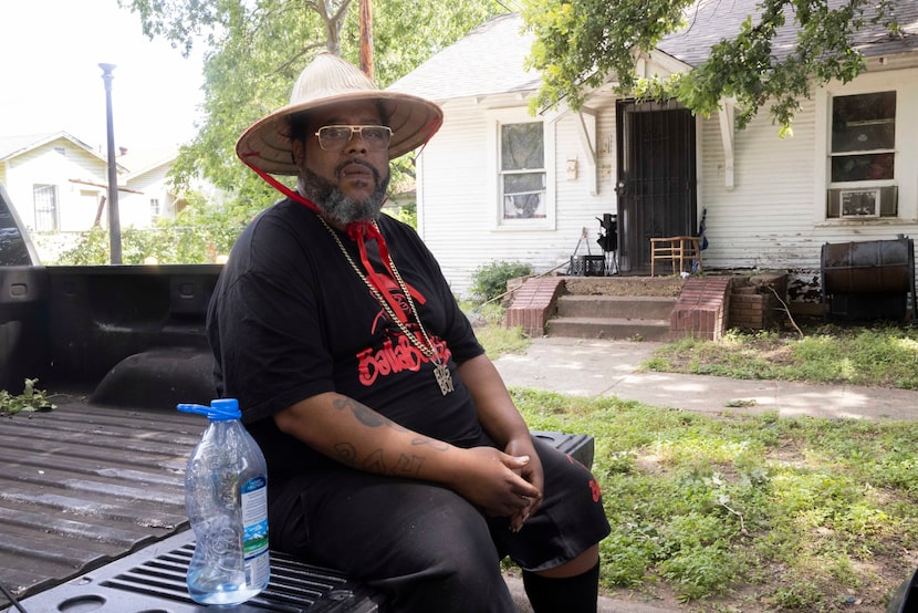 Robert Patterson sits in a shady spot outside his home Wednesday as he dealt with a second...