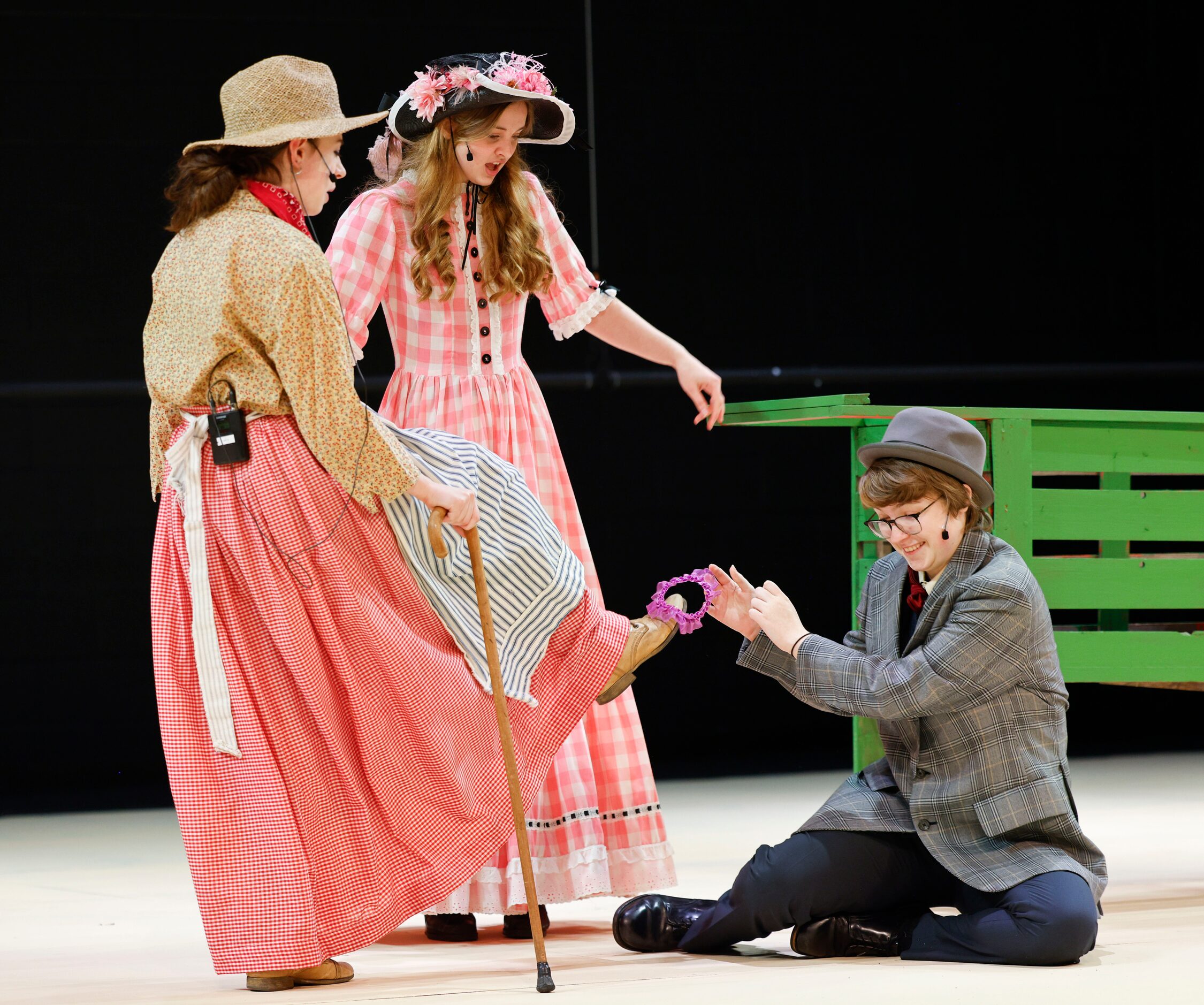 Kiersten Harston (left) as Aunt Eller, Avery Tollison (center) as Ado Annie, and Max...