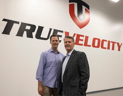 Chris Tedford (left), president and chief operating officer, and chairman and CEO Kevin...