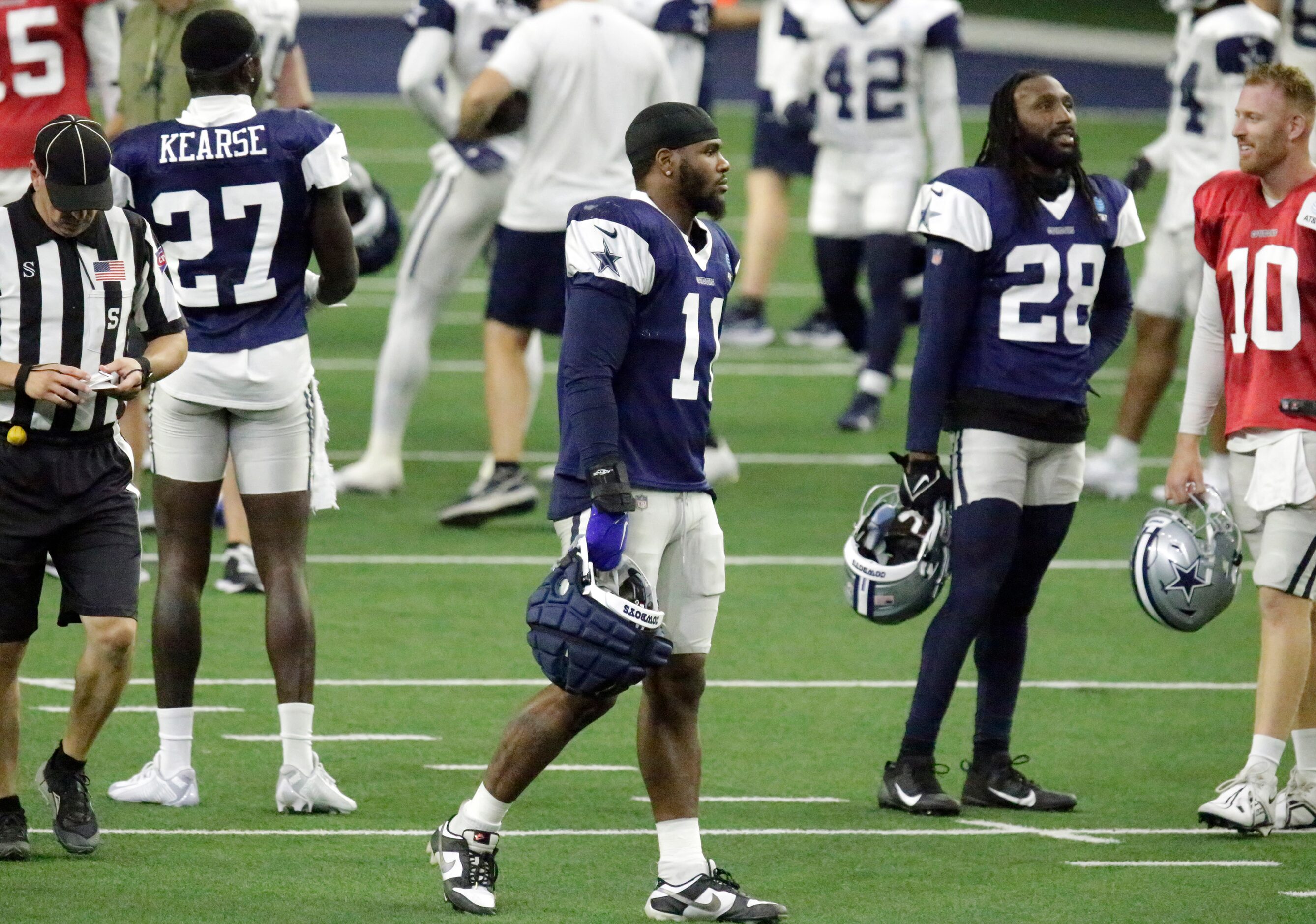 Dallas Cowboys linebacker Micah Parsons (11) walks to the next drill during a break as the...