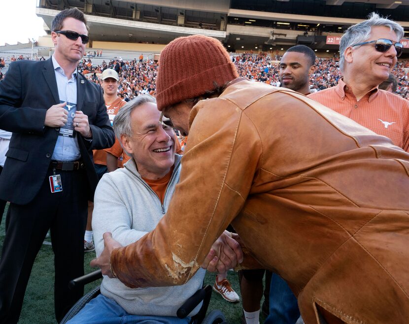 Matthew McConaughey greeted Gov. Greg Abbott at an April 2019 University of Texas Orange and...