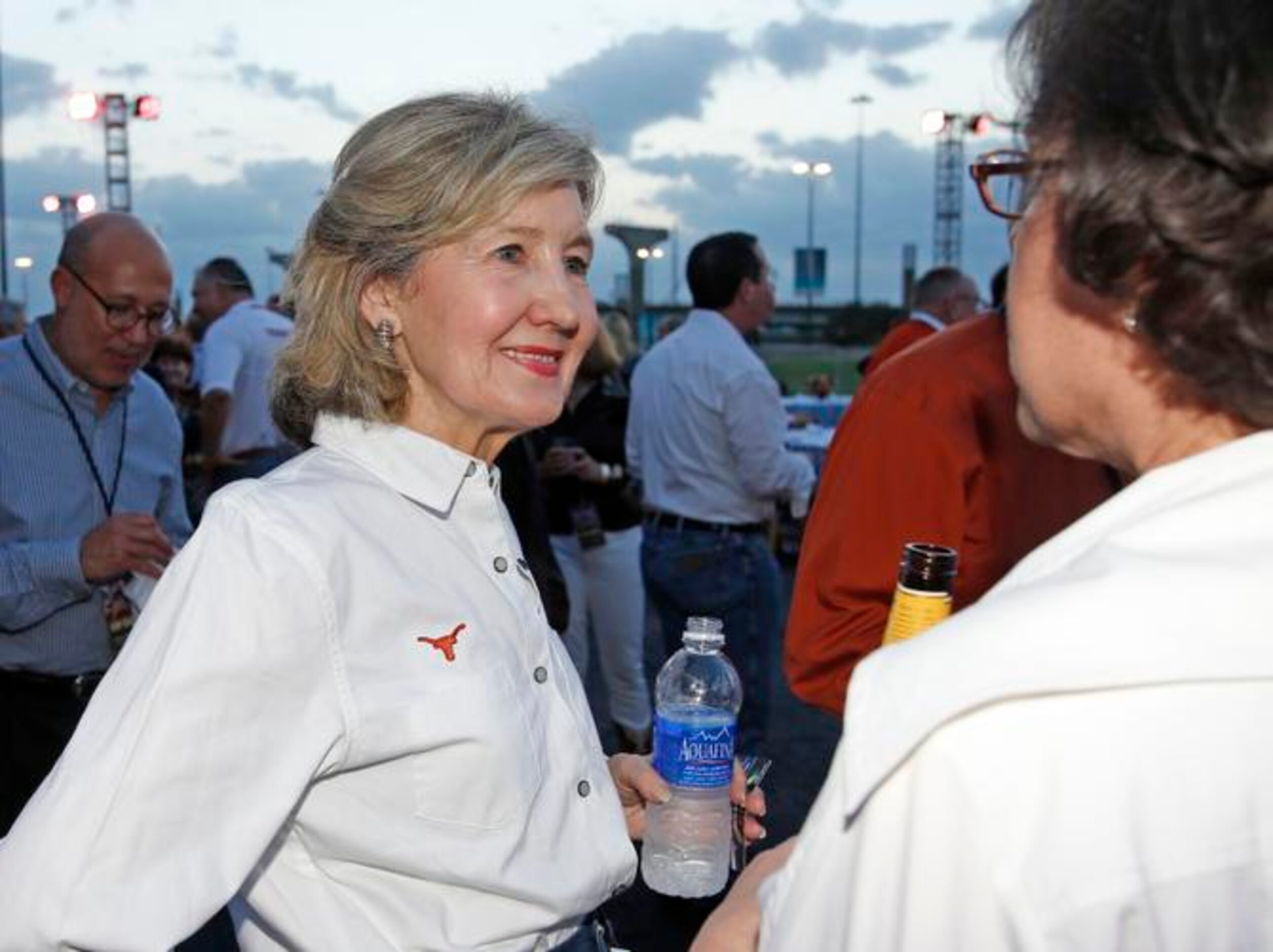 
Former United States Senator Kay Bailey Hutchison talks with friends during dinner at the...