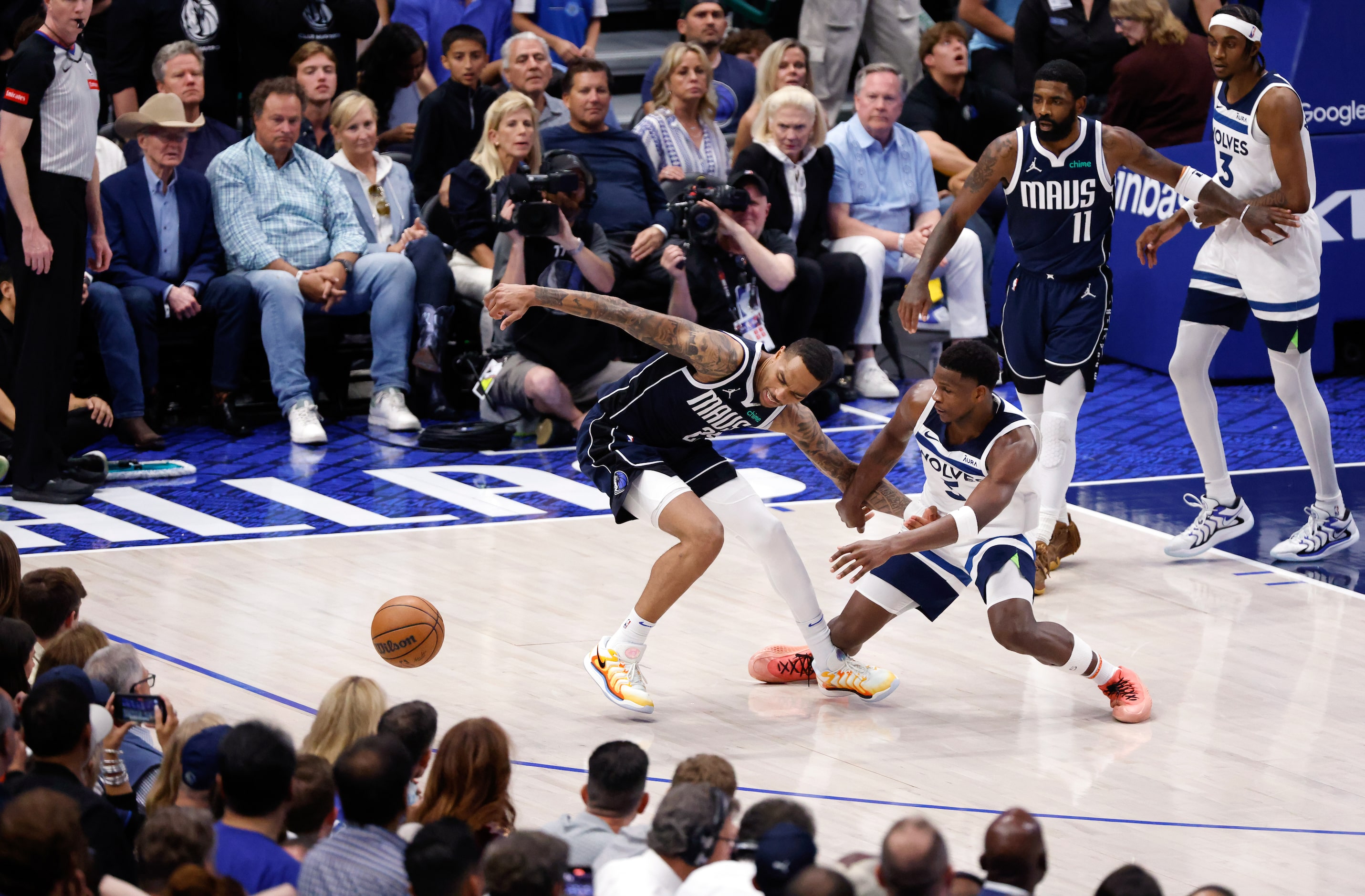 Dallas Mavericks forward P.J. Washington (25) has the ball knocked away by Minnesota...