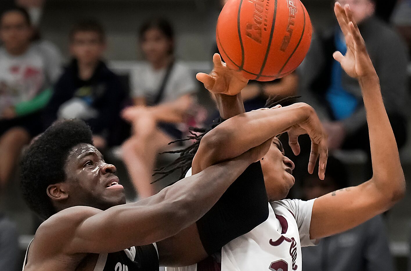 Plano forward Nikk Williams (22) is fouled by Denton Guyer forward Akintola Akinniyi (15) as...