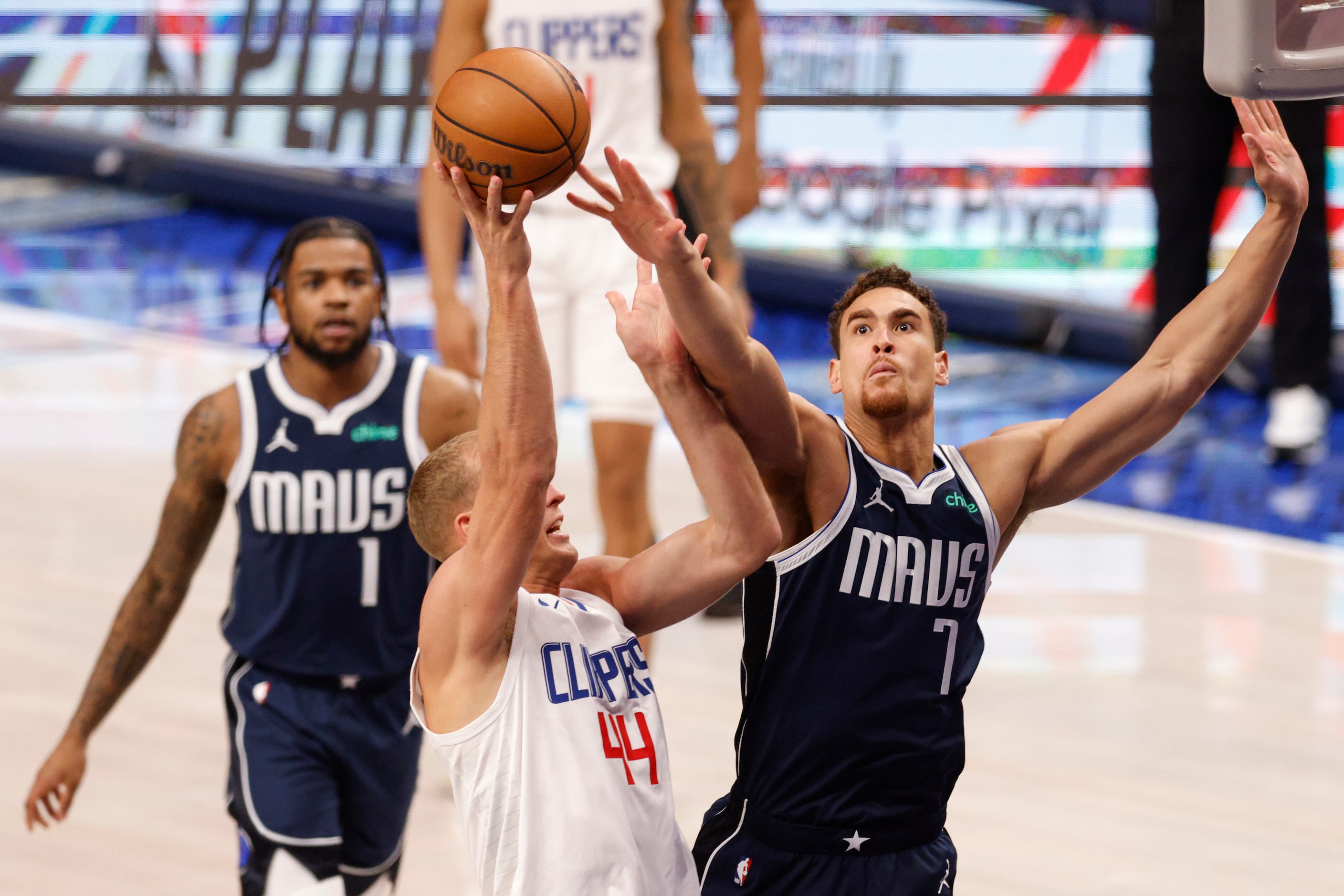 Dallas Mavericks center Dwight Powell (7) contests a shot attempt from LA Clippers center...