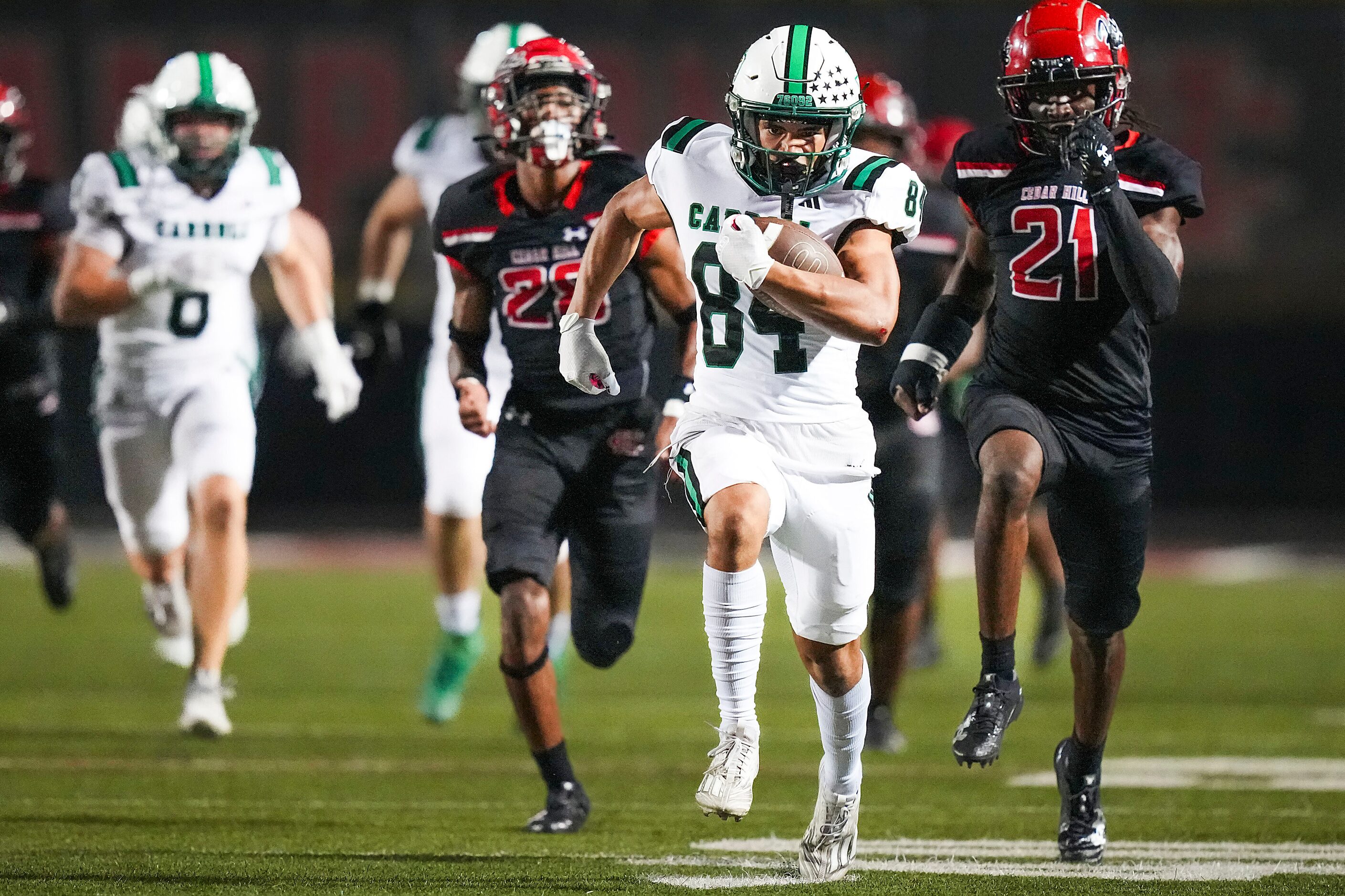 Southlake Carroll wide receiver Christian Glenn (84) races through the Cedar Hill defense on...