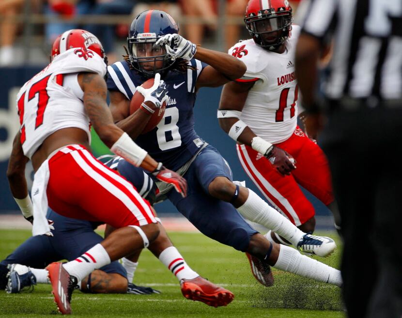Mississippi's Quincy Adeboyejo (8) cuts back in an effort to find a hole to run through in...