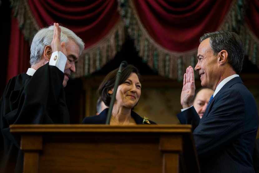 Texas State Representative Joe Straus, right, is sworn in as Speaker of the House by Texas...