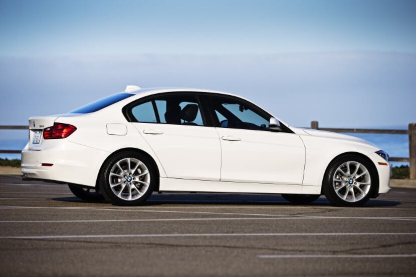 The 2013 BMW 320i, equipped with a four-cylinder engine, weighs about 3,300 pounds -- 200 or...