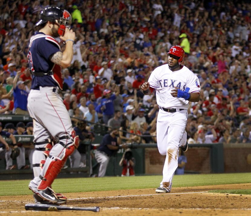 Texas Rangers shortstop Hanser Alberto (68) scores his first run on a single by Leonys...