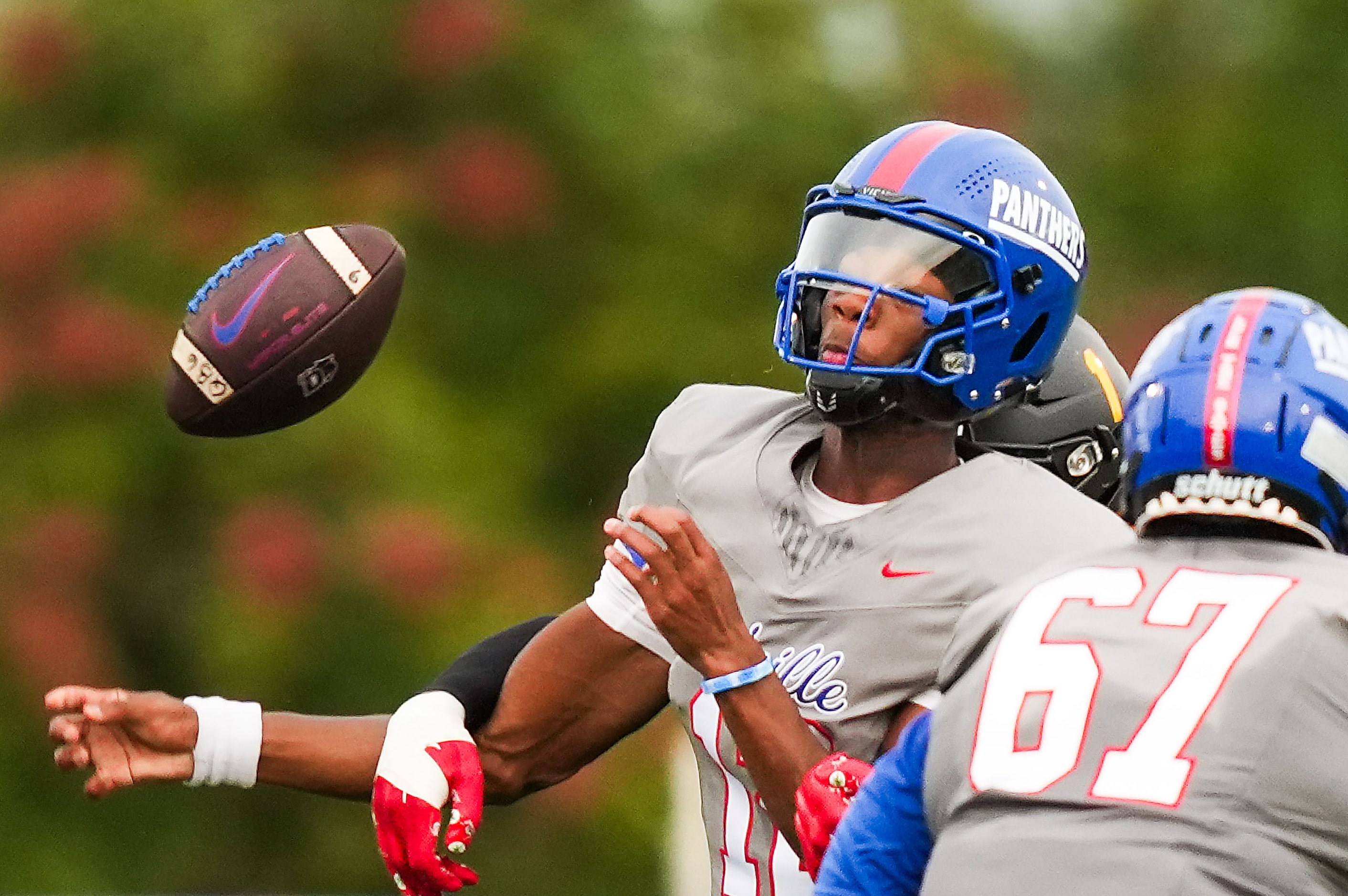 Duncanville quarterback Keelon Russell (12) fumbles as he is hit by St. Frances Academy...