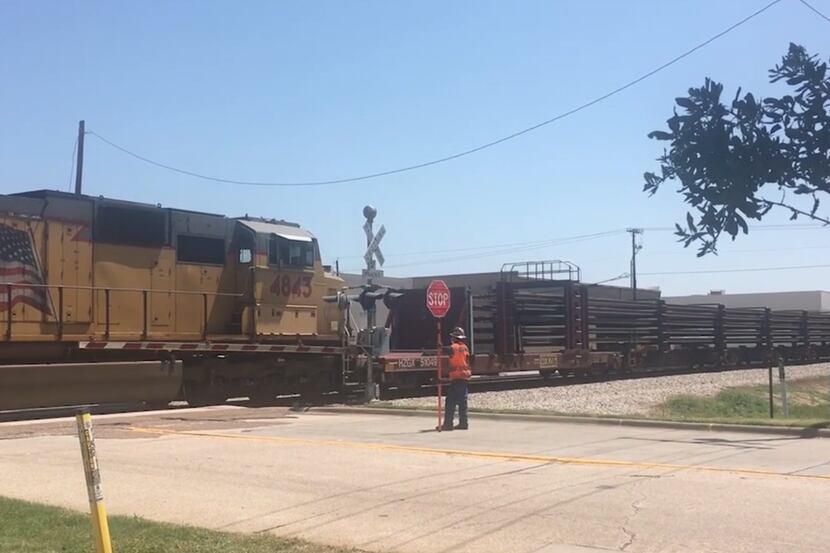 Rails for DART's Silver Line project are being delivered by train.