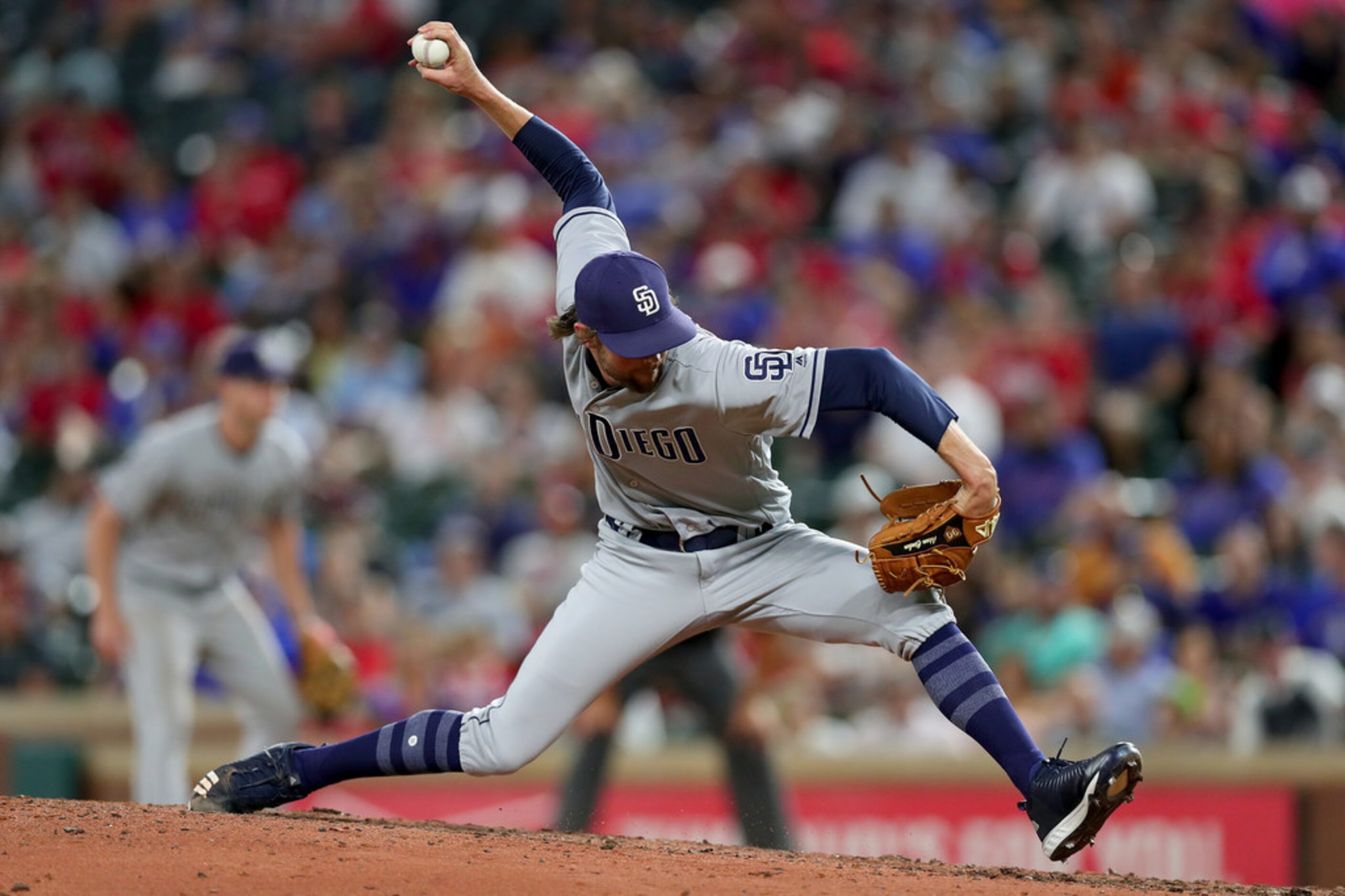 ARLINGTON, TX - JUNE 25:  Adam Cimber #90 of the San Diego Padres pitches against the Texas...