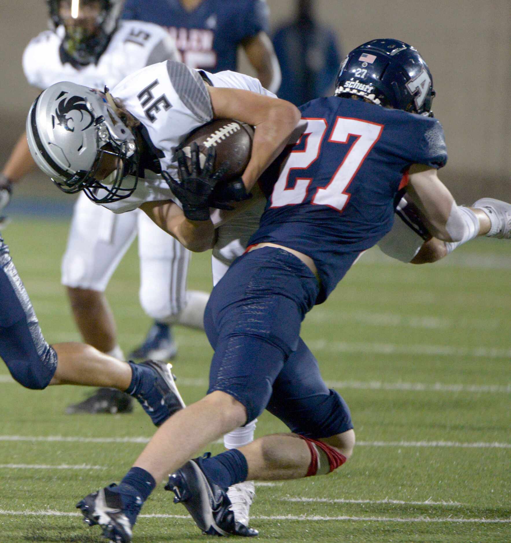 Allen’s Caison Smith (27) tackles Denton Guyer’s Bryson Riggs (34) in the second quarter of...