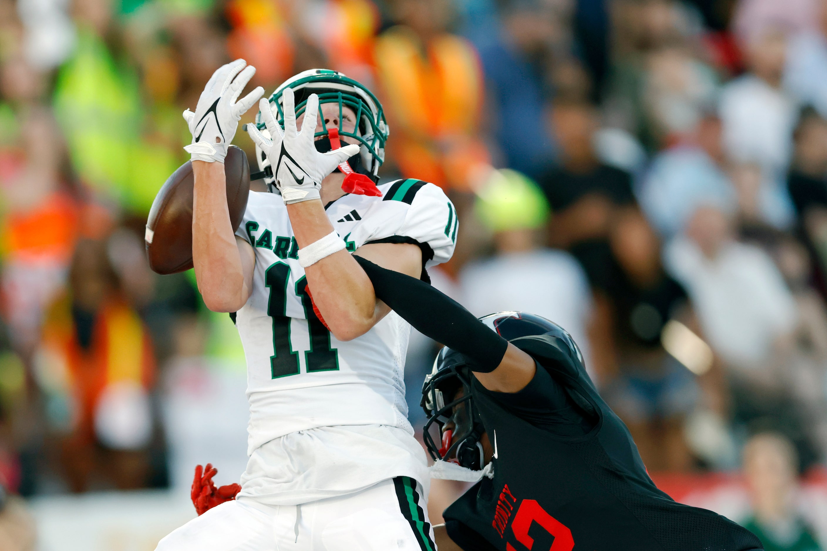 Euless Trinity defensive back Lemariea Parson (12) breaks up a pass intended for Southlake...