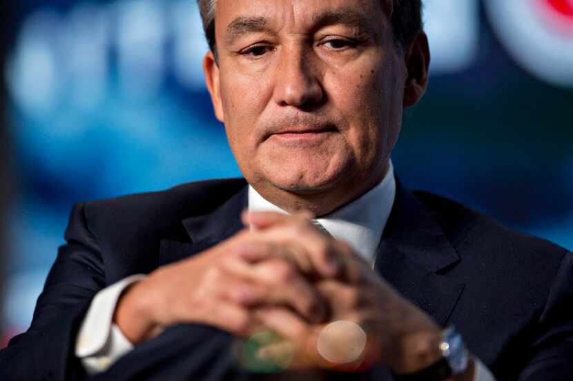 Oscar Munoz, chief executive officer of United Continental Holdings Inc., listens to a...