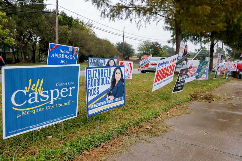 Campaign signs line the sidewalk at a polling place on Election Day at Lakeside Activity...