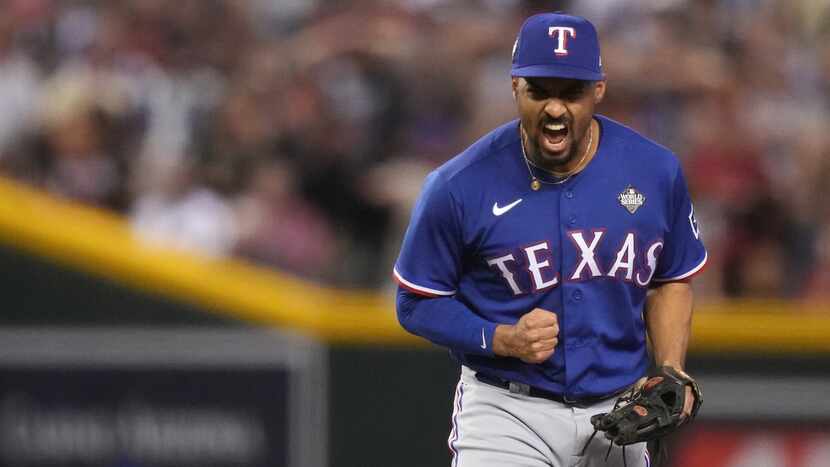 Texas Rangers second baseman Marcus Semien celebrates turning a double play, forcing out...
