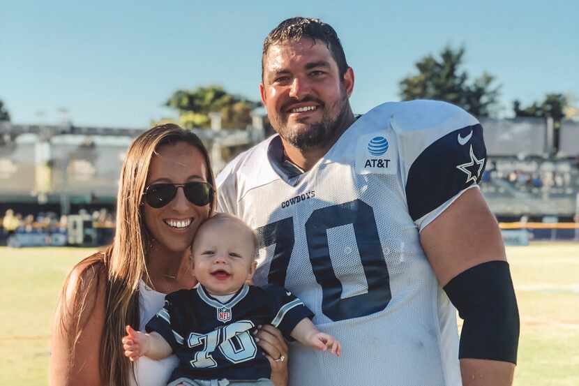 Cowboys offensive lineman Zack Martin poses with his wife, Morgan, and his son, Charlie, at...