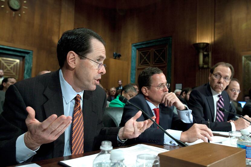 AT&T President and CEO Randall Stephenson, left, testifies on Capitol Hill in Washington,...