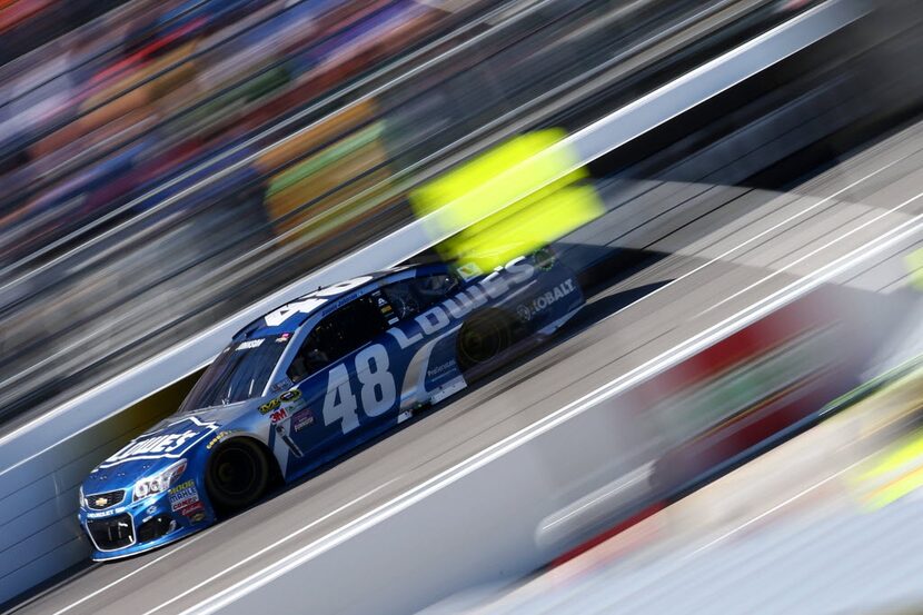 MARTINSVILLE, VA - APRIL 03:  Jimmie Johnson, driver of the #48 Lowe's Chevrolet, races...