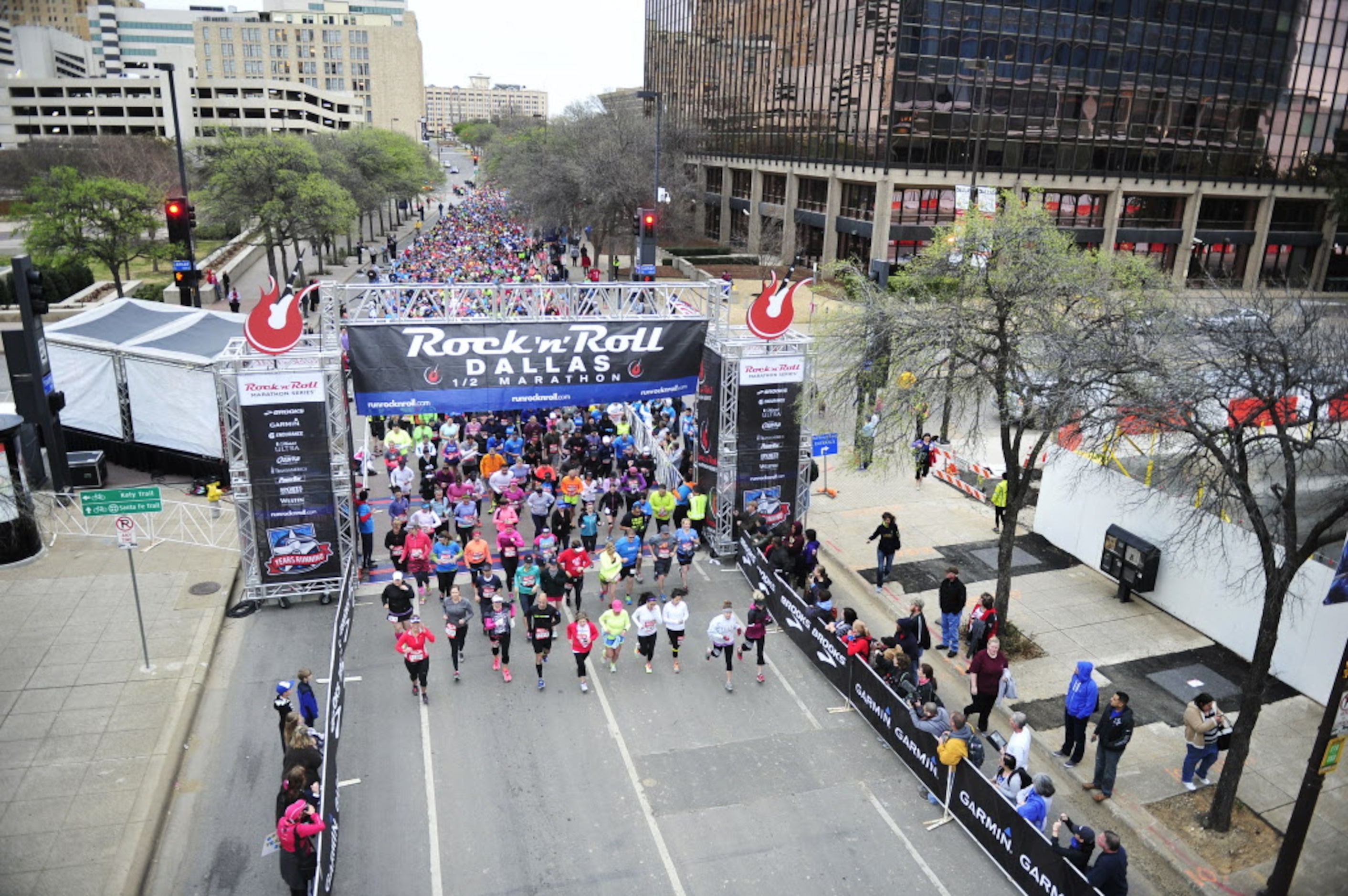 Runners line up down Young St. as they begin the Dallas Rock N' Roll half-marathon on...