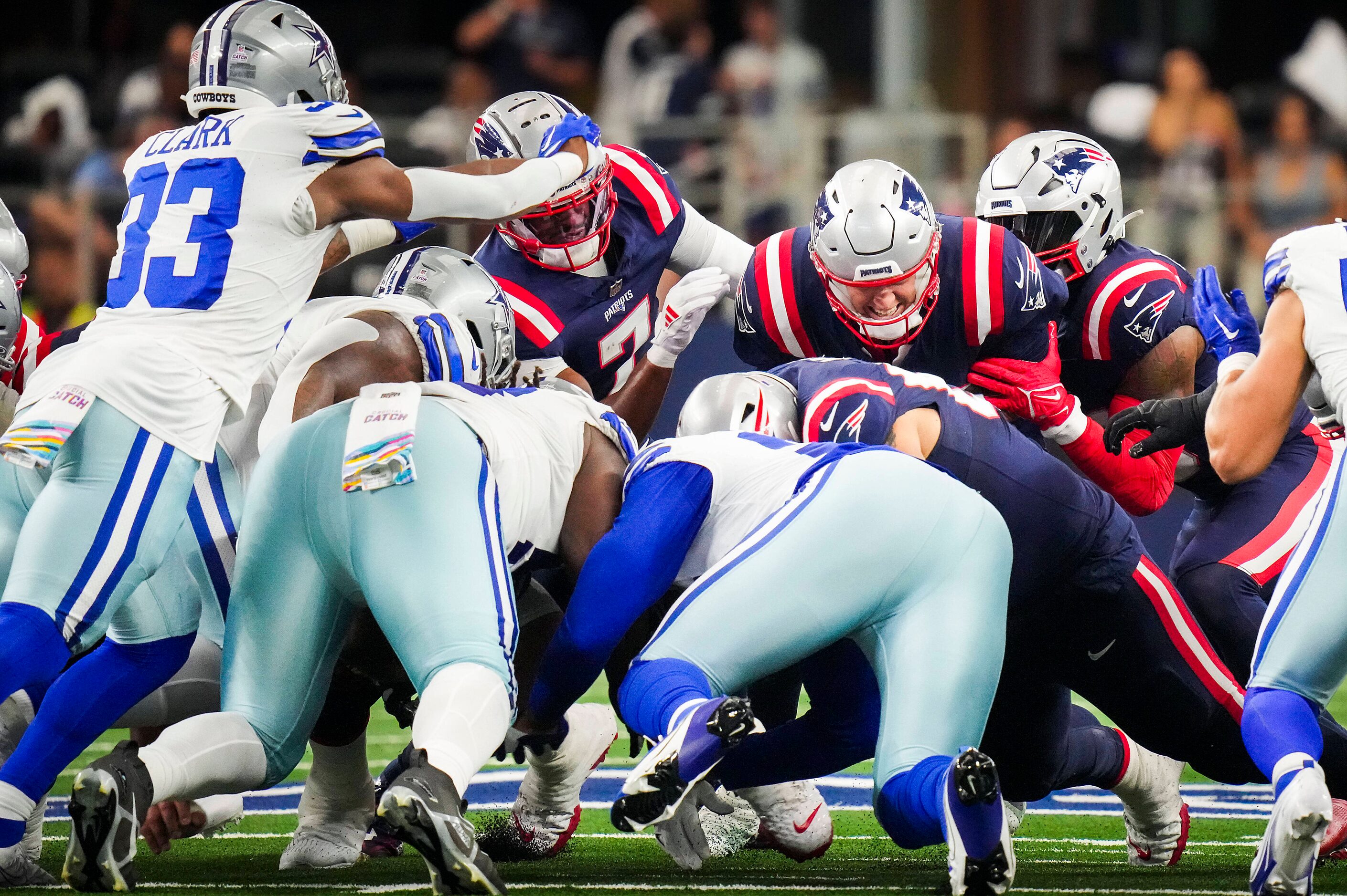 New England Patriots quarterback Mac Jones (10) is stopped on a fourth-and-one at midfield...