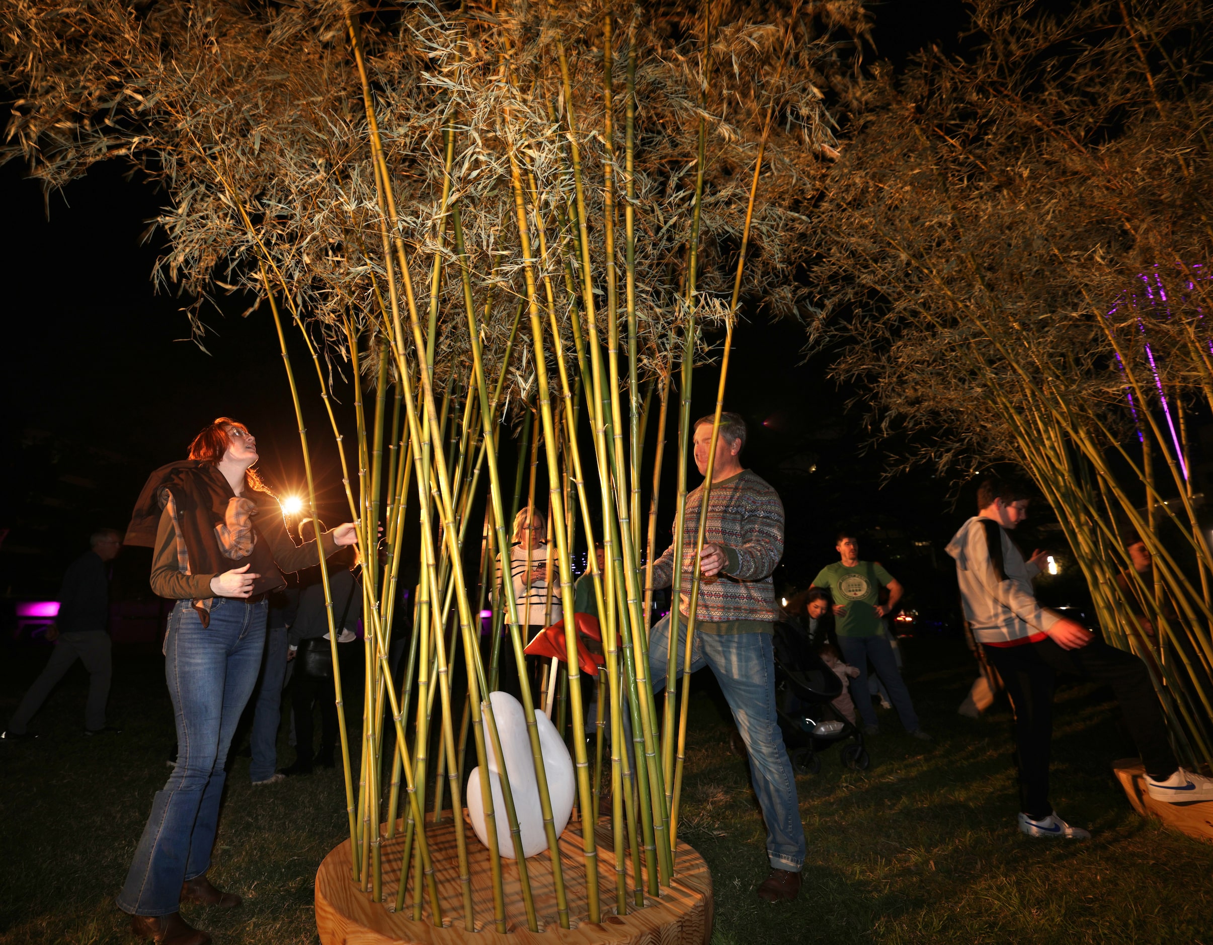 Community members interact with art installations during Aurora in downtown Dallas, TX, on...