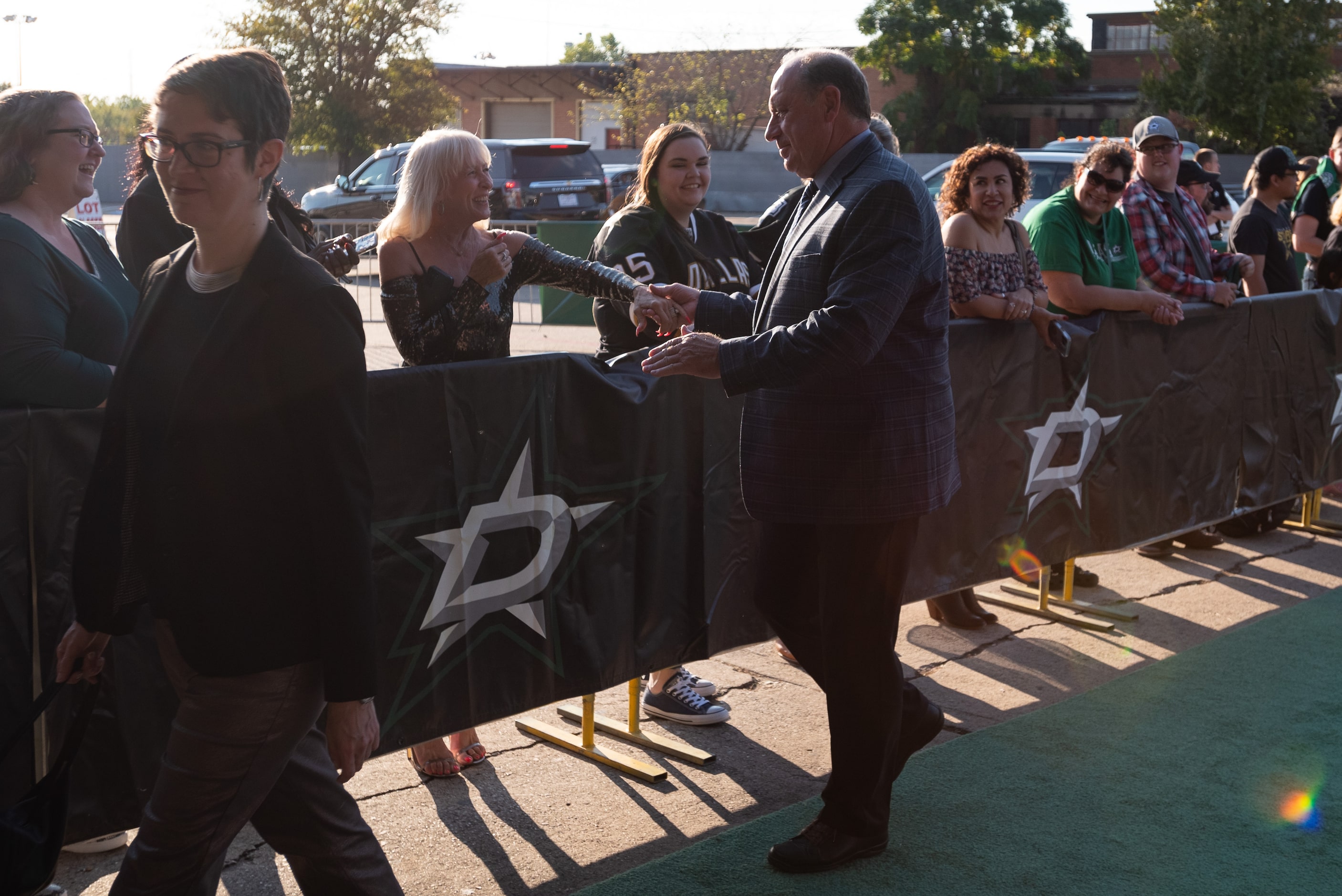 Dallas Stars former general manager Bob Gainey, with Anna Gainey, left, greets fans as he...