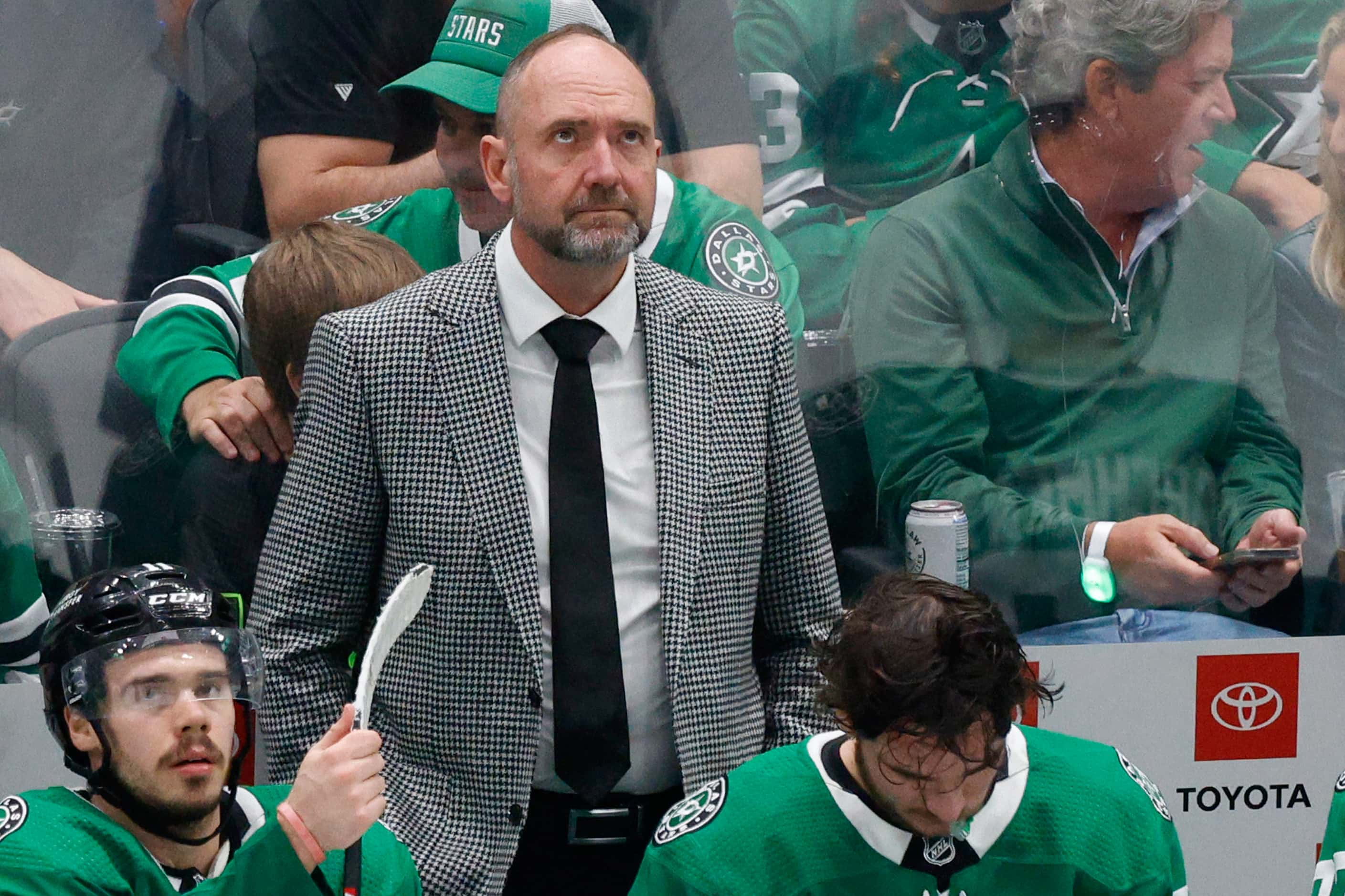 Dallas Stars head coach Peter DeBoer looks up the scoreboard in the third period during Game...