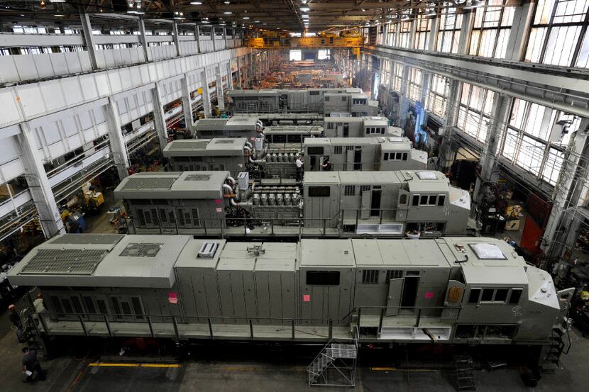This 2011 photo shows General Electric Evolution Series locomotives being assembled in...