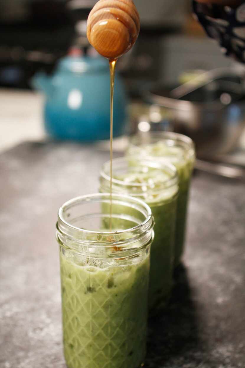 Iced matcha and honey latte is made with matcha green tea powder.