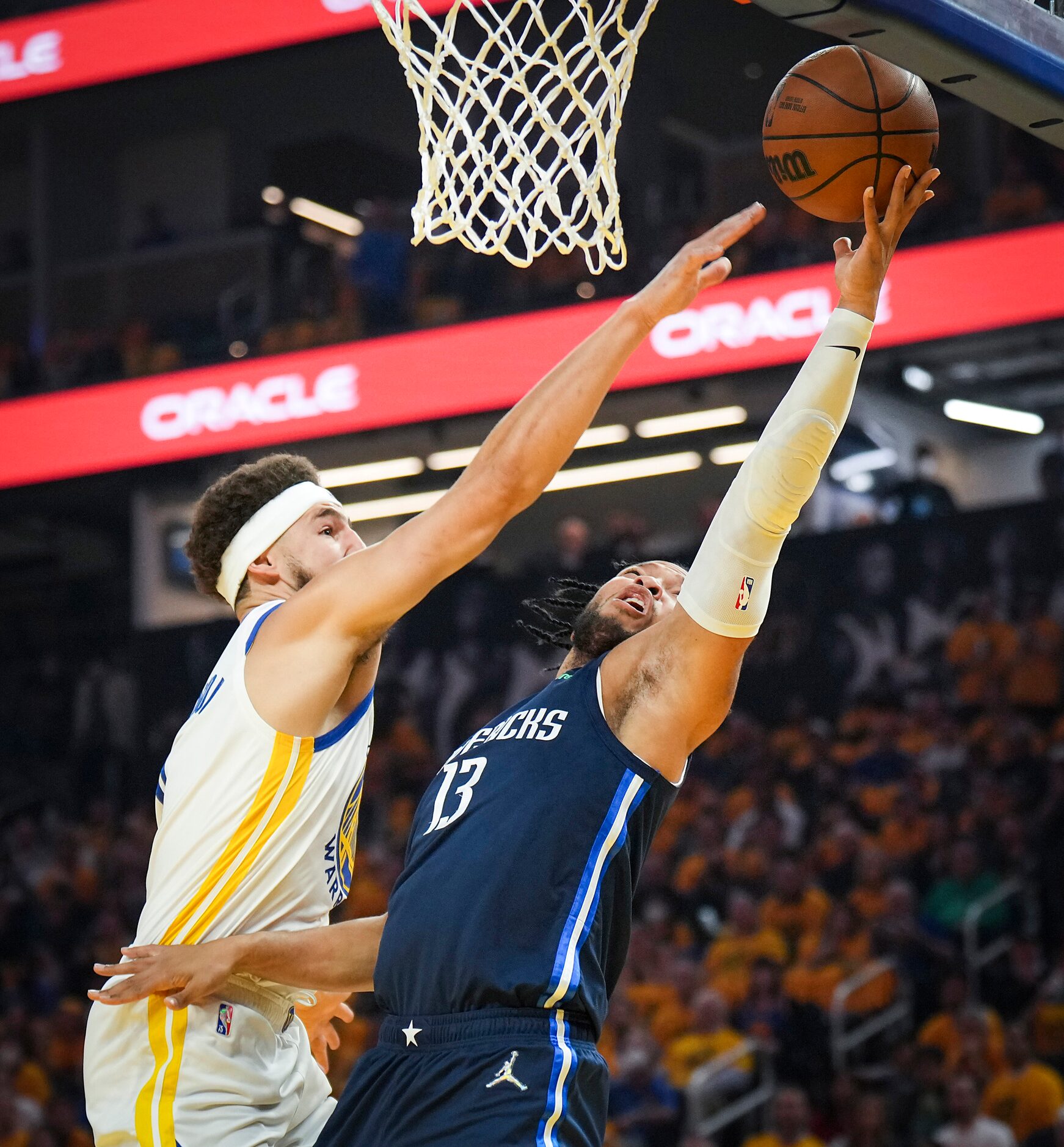 Dallas Mavericks guard Jalen Brunson (13) shoots past Golden State Warriors guard Klay...