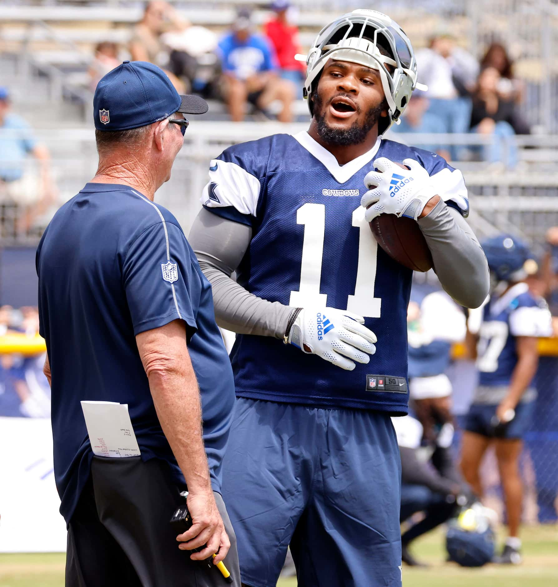 Dallas Cowboys linebacker Micah Parsons (11) smiles as he approaches Dallas Cowboys...