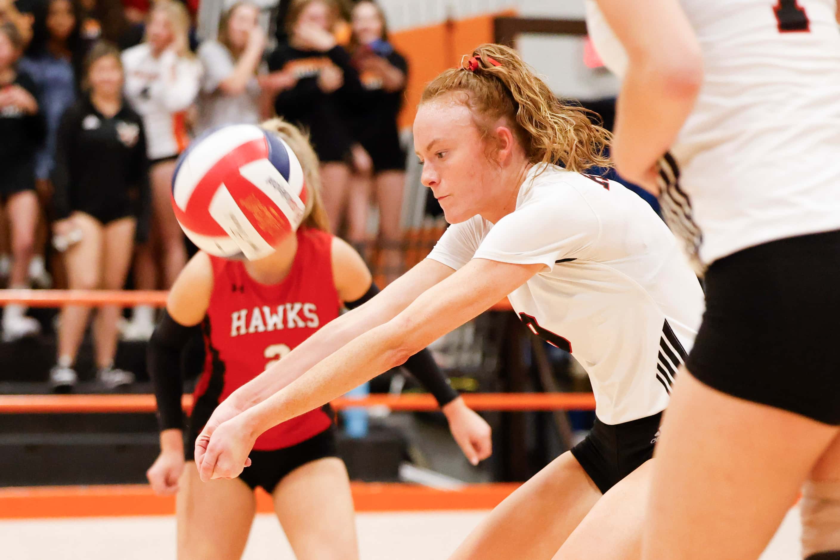 Rockwall heath’s Presley McGriff digs the ball during a volleyball game against Rockwall...