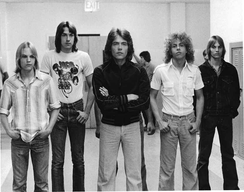 Mark Ridlen, second from right, was a member of the fictional band Rapid Fire, as well as...