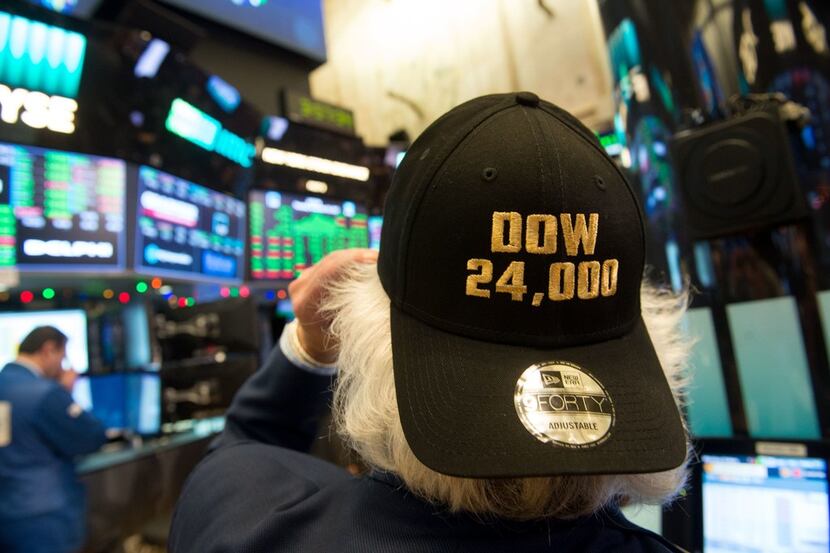 A trader works on the floor at the closing bell of the Dow Industrial Average at the New...