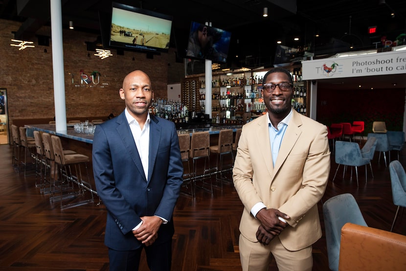 Owner Kevin Kelley (left) and general manager Rico Spears at True Kitchen + Kocktails...