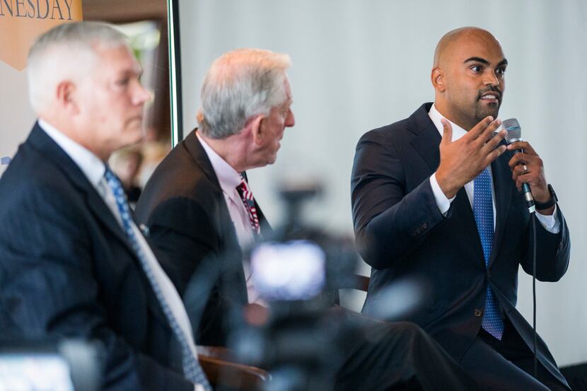 Congressional candidate Colin Allred (right) debates Pete Sessions (left) at a Rotary Club...