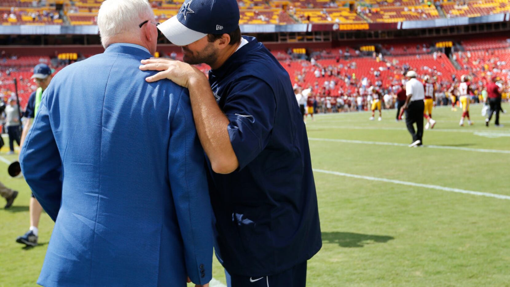 Dallas Cowboys quarterback Tony Romo (9) talks to Dallas Cowboys owner and general manager...