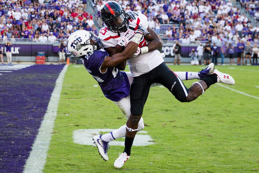 Texas Tech defensive back Douglas Coleman (25) intercepts a pass intended for TCU wide...