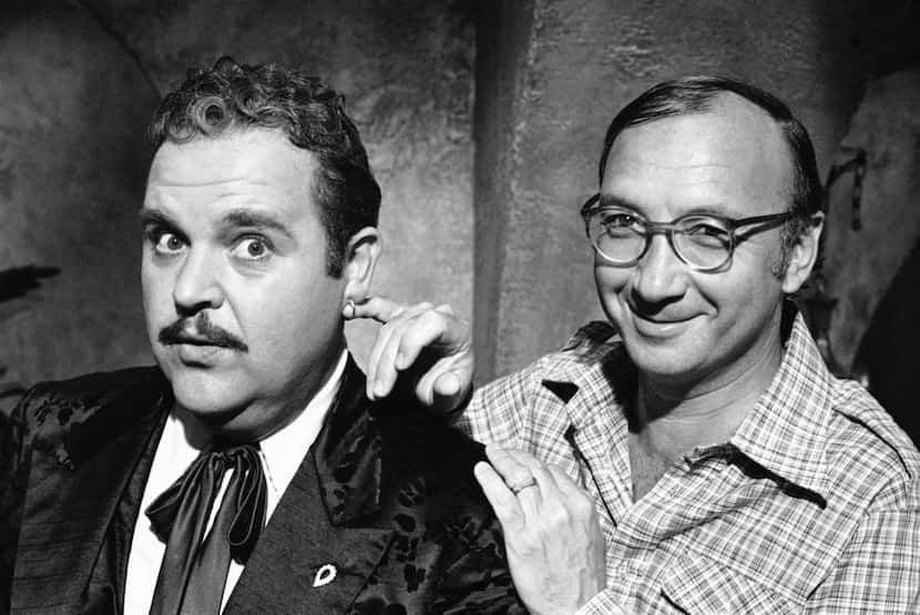 In this July 2, 1977, file photo, playwright Neil Simon (right) poses for a photo on the set...