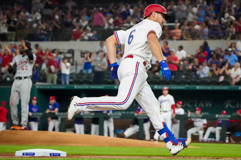 Texas Rangers catcher John Hicks rounds the bases after hitting a two-run home run off of...