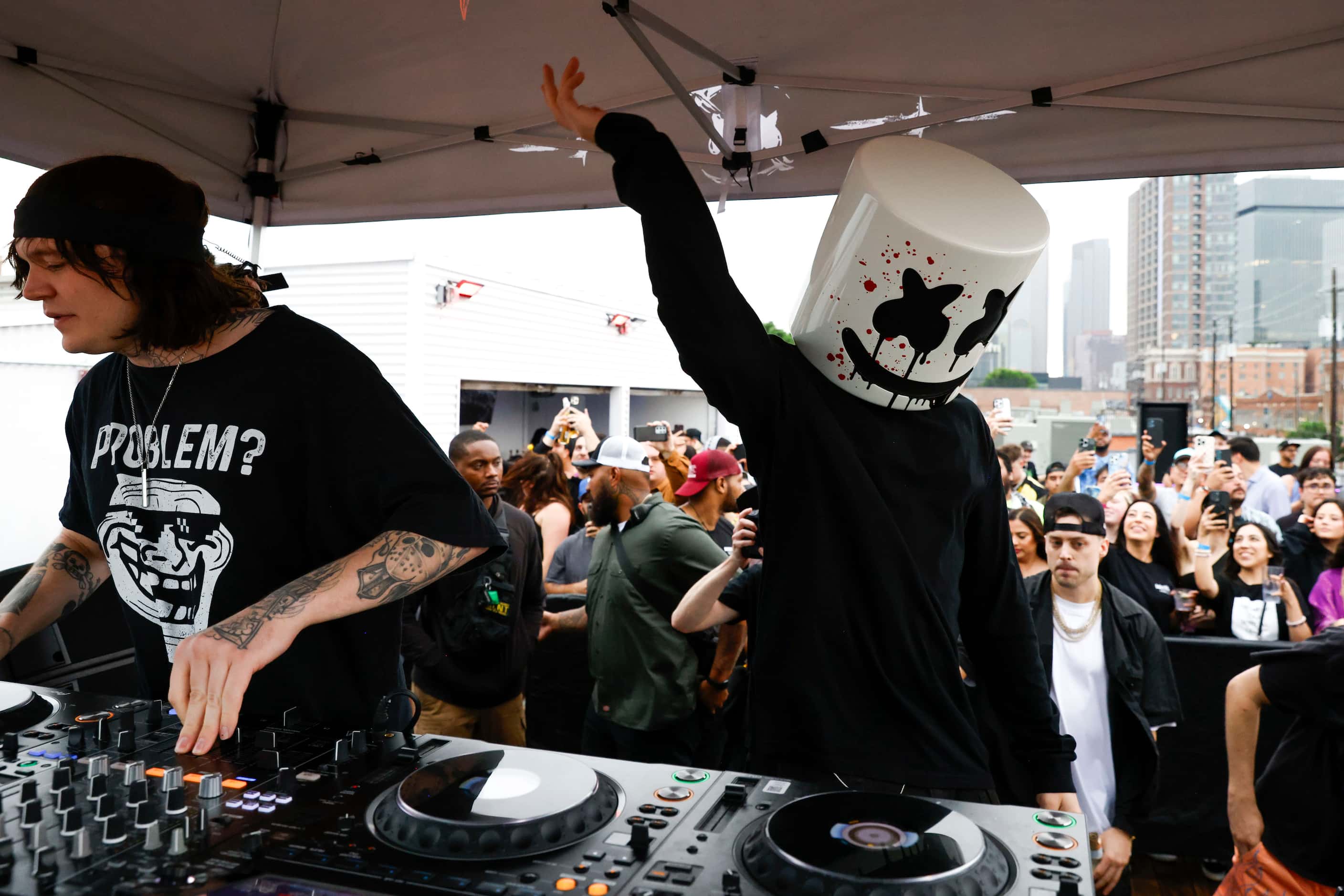 DJ Svdden Death (left) and Marshmello, perform during a surprise pop up show on Friday,...