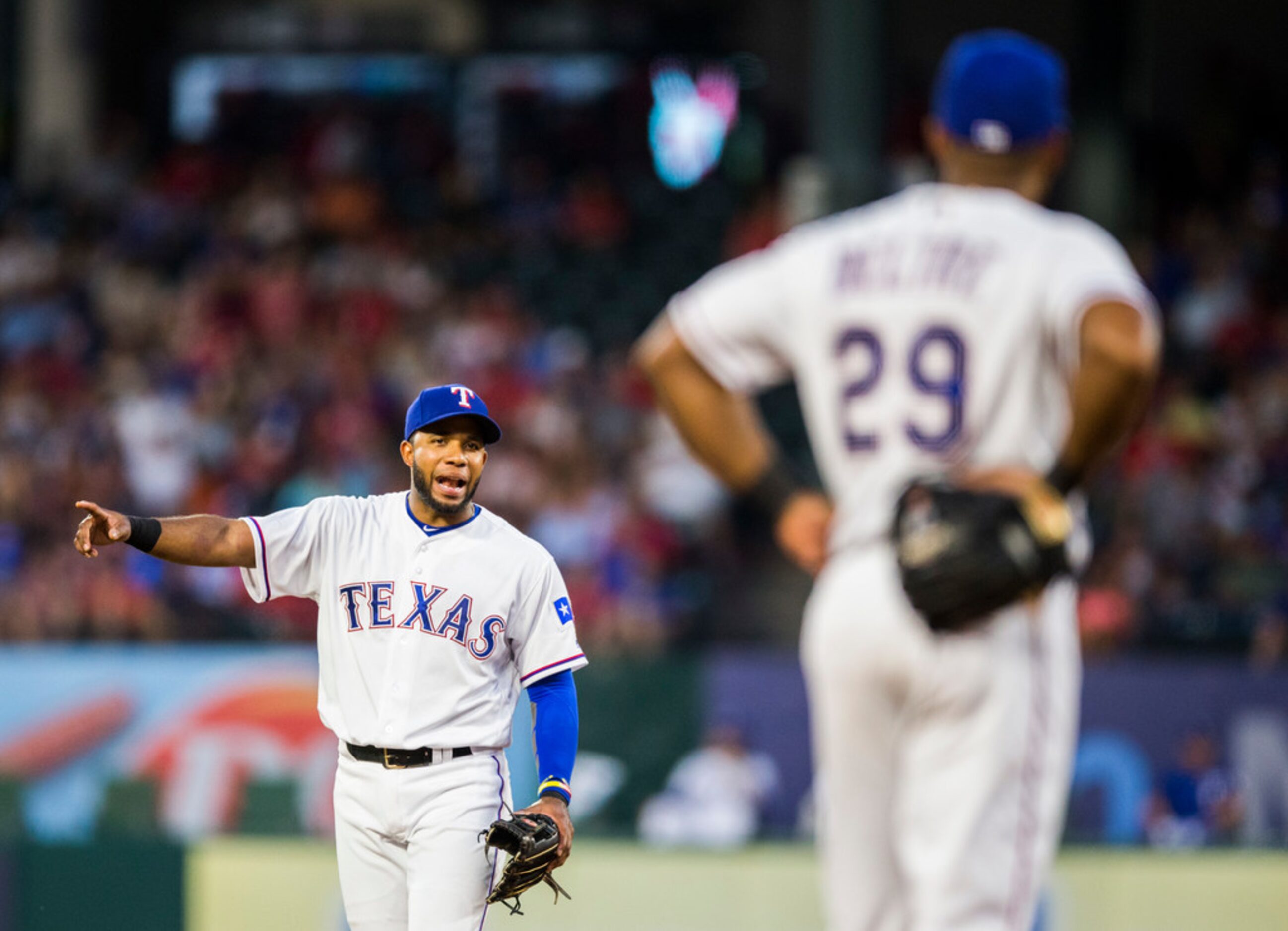 Texas Rangers shortstop Elvis Andrus (1) talks to third baseman Adrian Beltre (29) during...