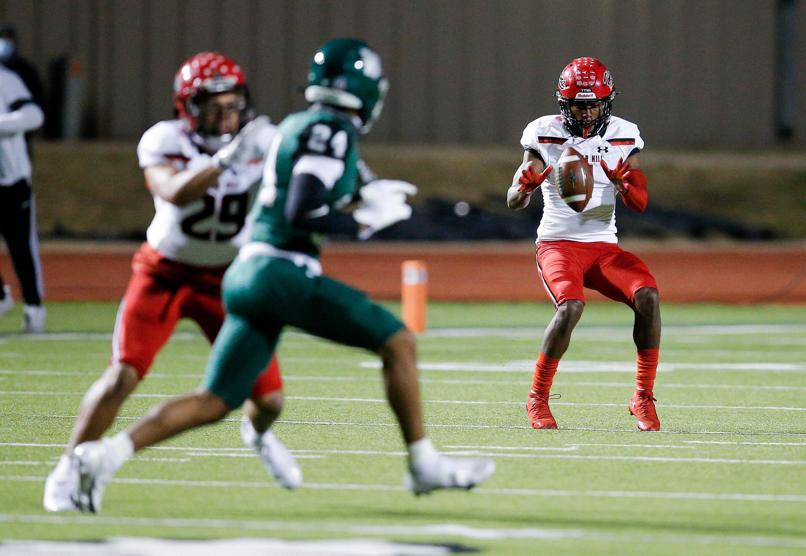 Cedar Hill senior Anthony Thomas IV (1) fields a Waxahachie kick during the first half of a...