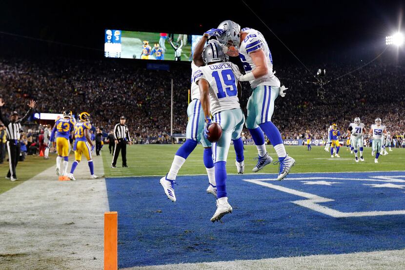 Dallas Cowboys wide receiver Amari Cooper (19) celebrates his first quarter touchdown with...