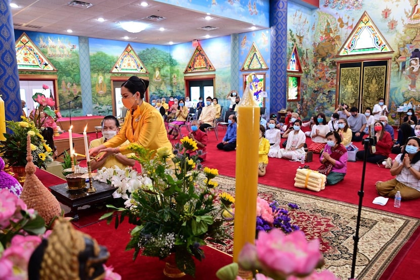 At a Royal Kathina, attendees give offerings of blankets, pillows, toilet paper, paper...