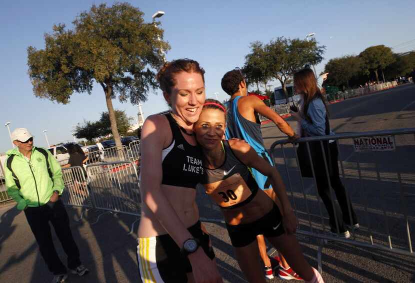 Jen Smith (left) hugged female first-place winner Dawn Grunnagle during the Komen Dallas...